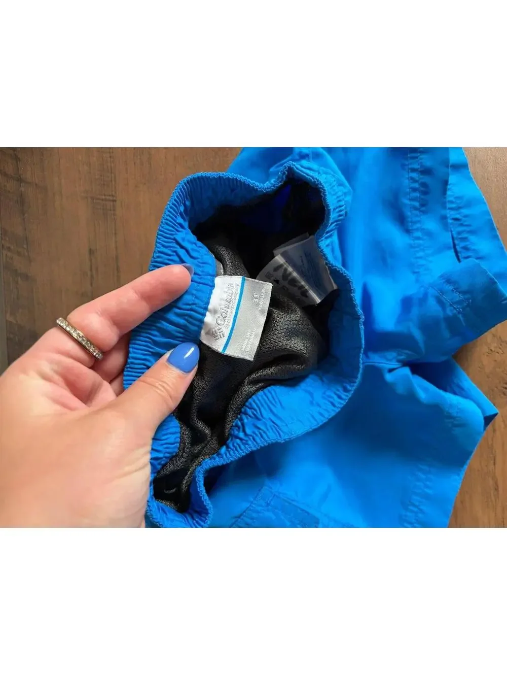 Columbia blue swim trunks size 3T. Name written on tag
